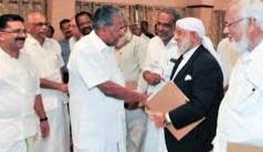 Pinarayi Vijayan with Priest