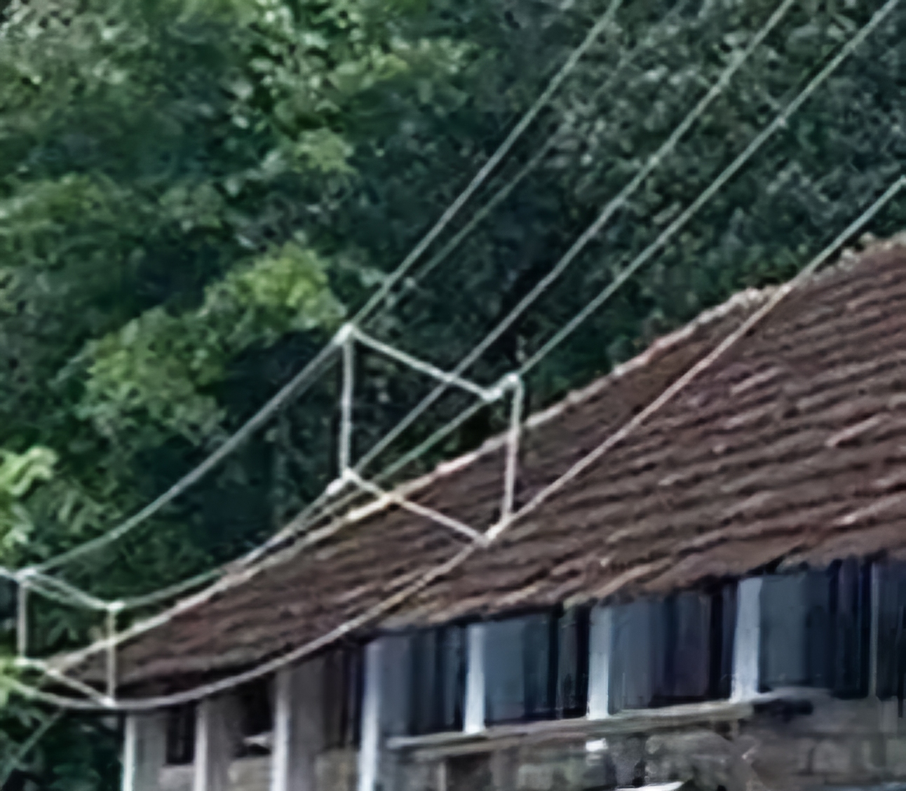  Electric line almost kissing the school roof at Thevalakkara 