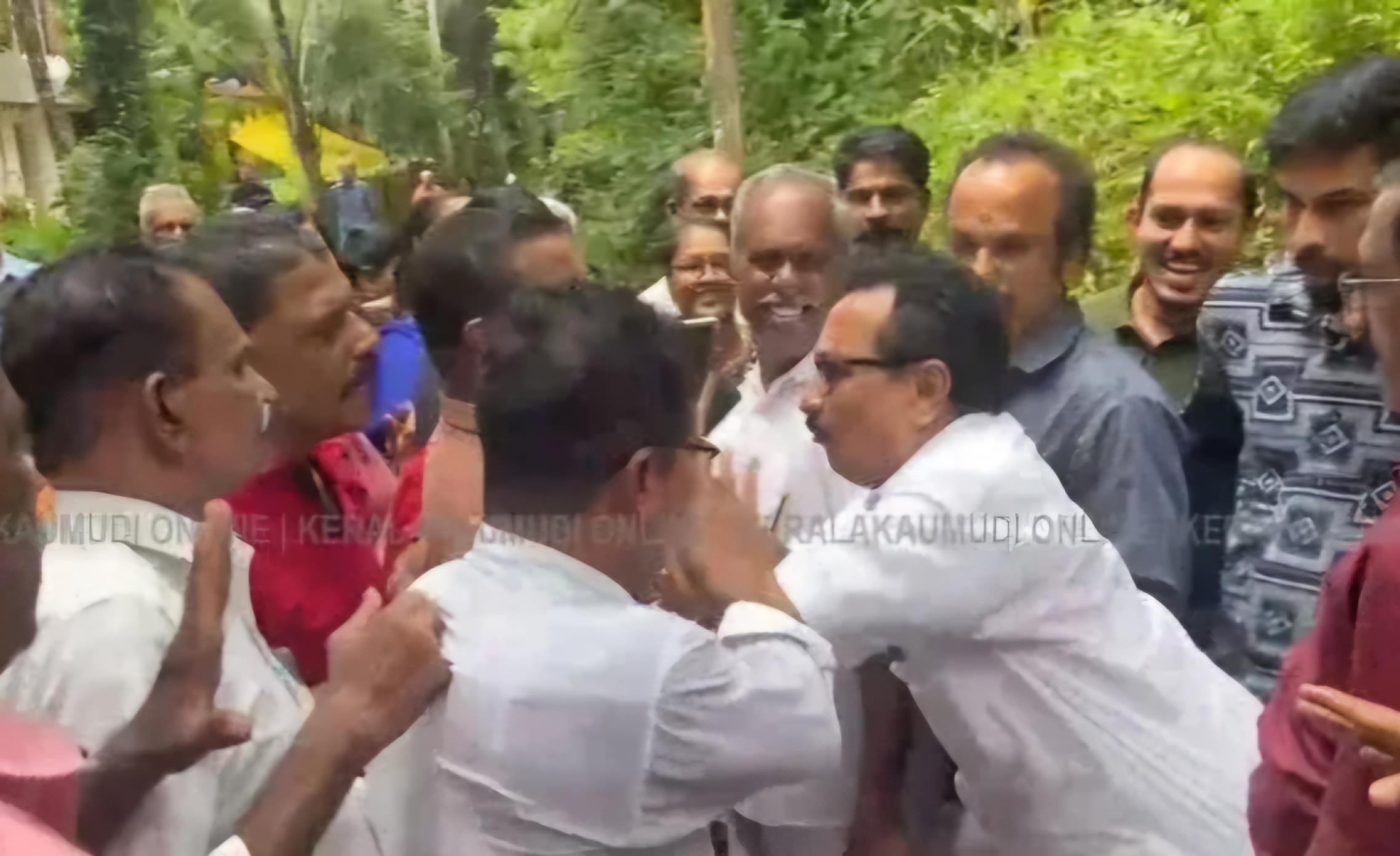 K P Mohanan pushing through the crowd